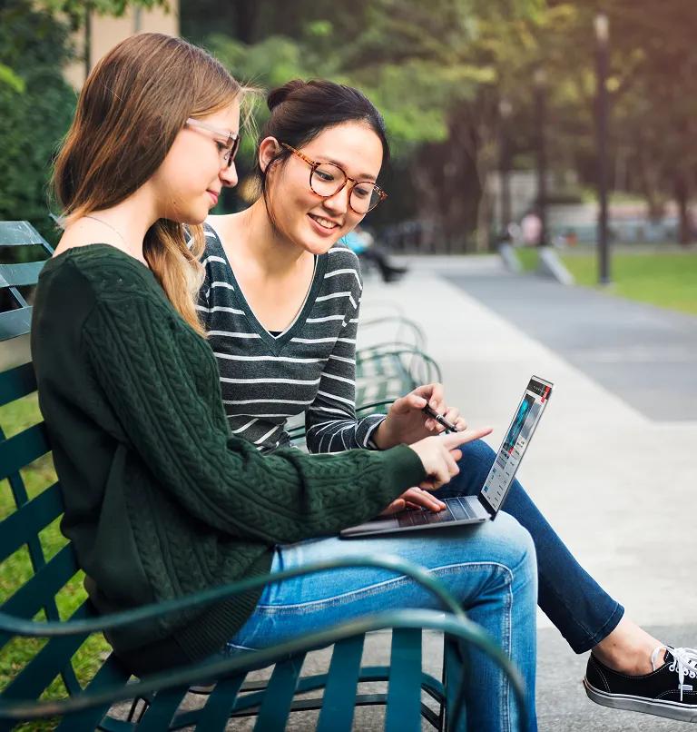 Student studying outdoors on campus