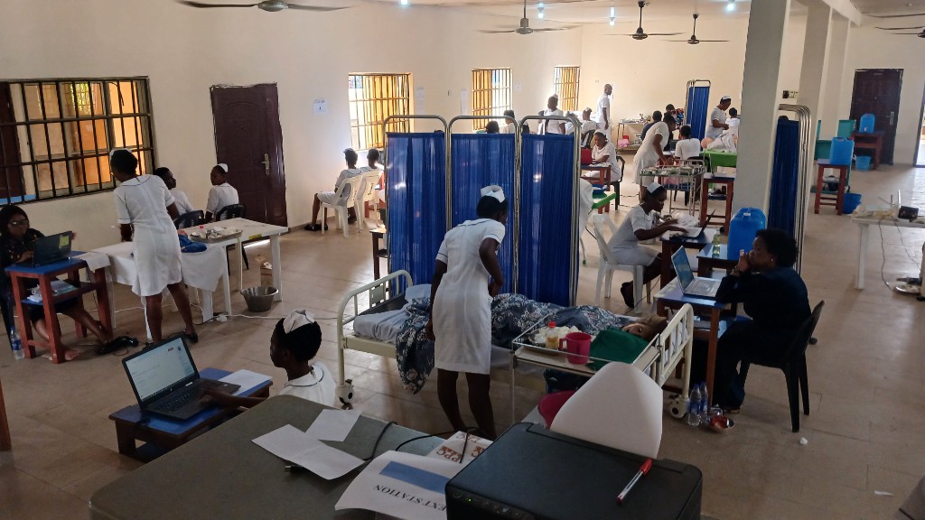 Busy nursing simulation laboratory with students and instructors